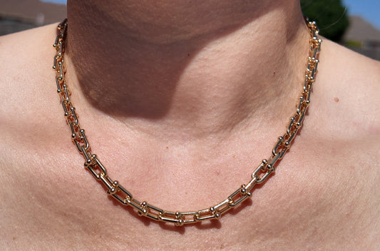 Model wearing the gold Blaire paperclip chain necklace styled as an elevated everyday layering piece