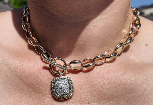 Model wearing the Celeste Toggle Necklace styled as an elevated everyday statement piece