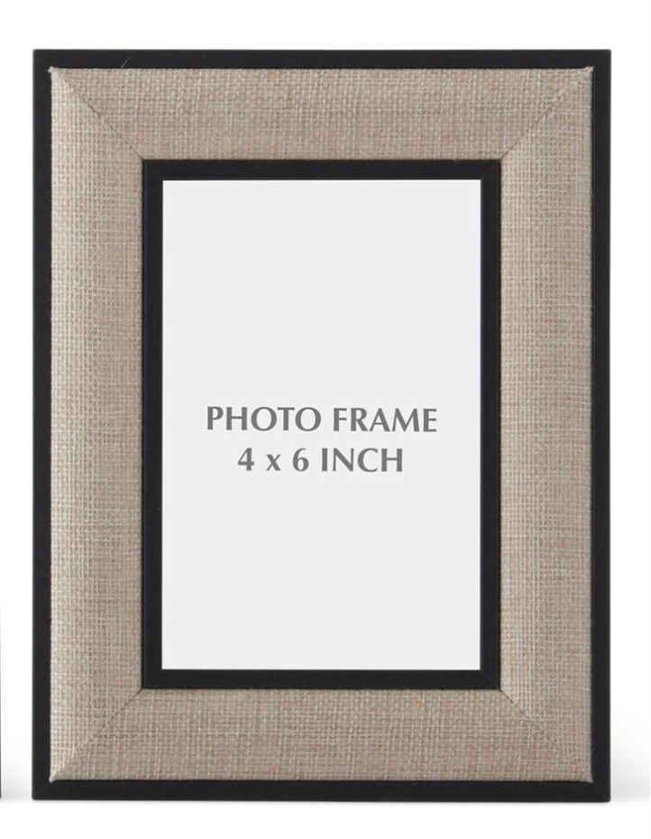 Petite black and natural linen tabletop photo frame designed to hold a 4-by-6-inch photograph.