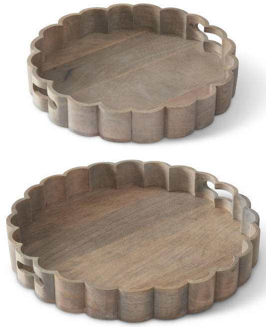 Two wooden trays with scalloped edges on a white background