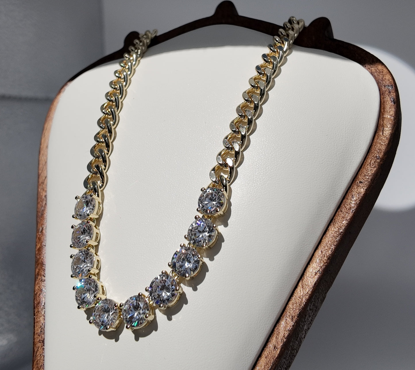 Gold crystal statement necklace with oversized round cubic zirconia stones and bold chain detailing by Scissortail Rose Collection