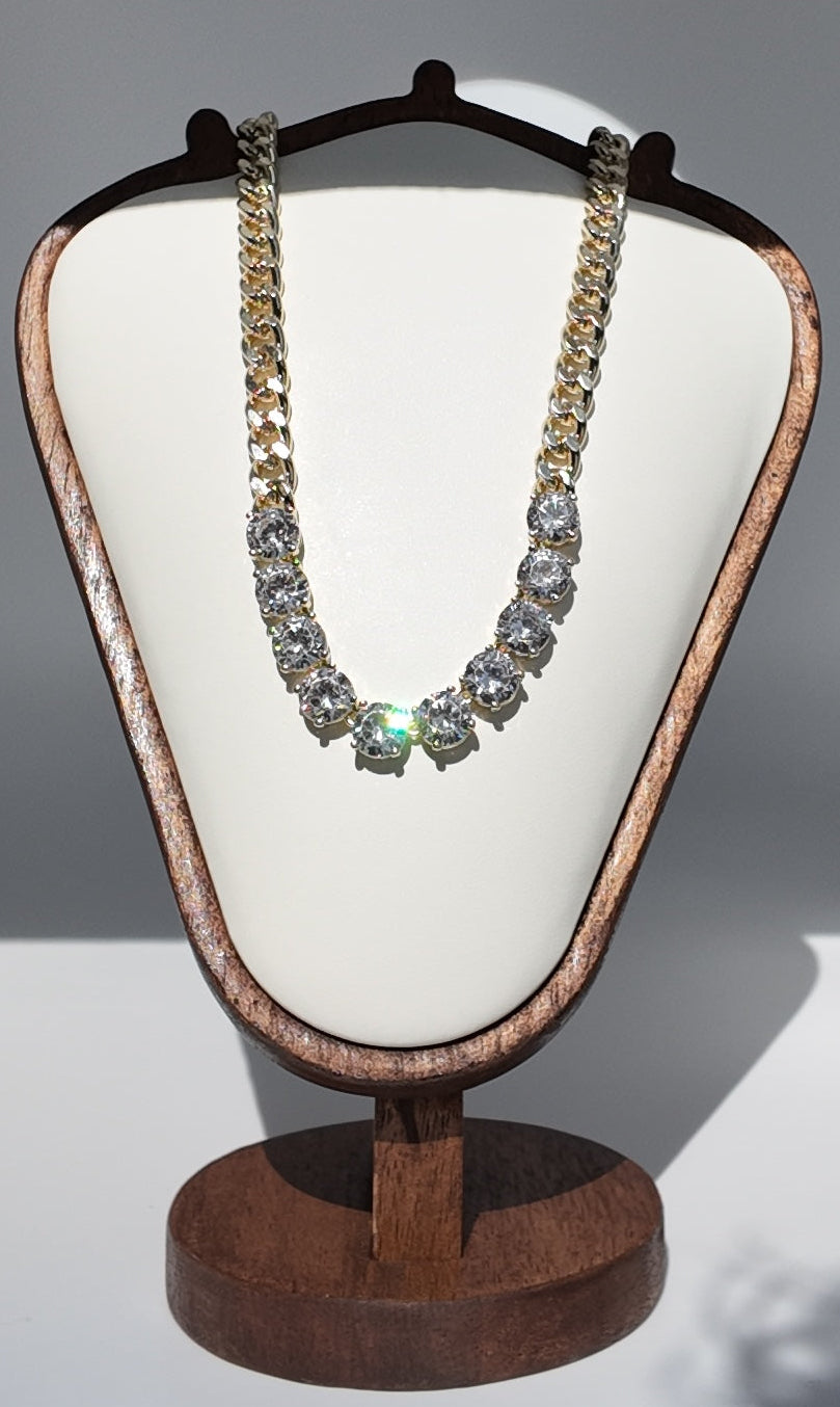 Gold crystal chain necklace displayed on jewelry stand with oversized round cubic zirconia stones