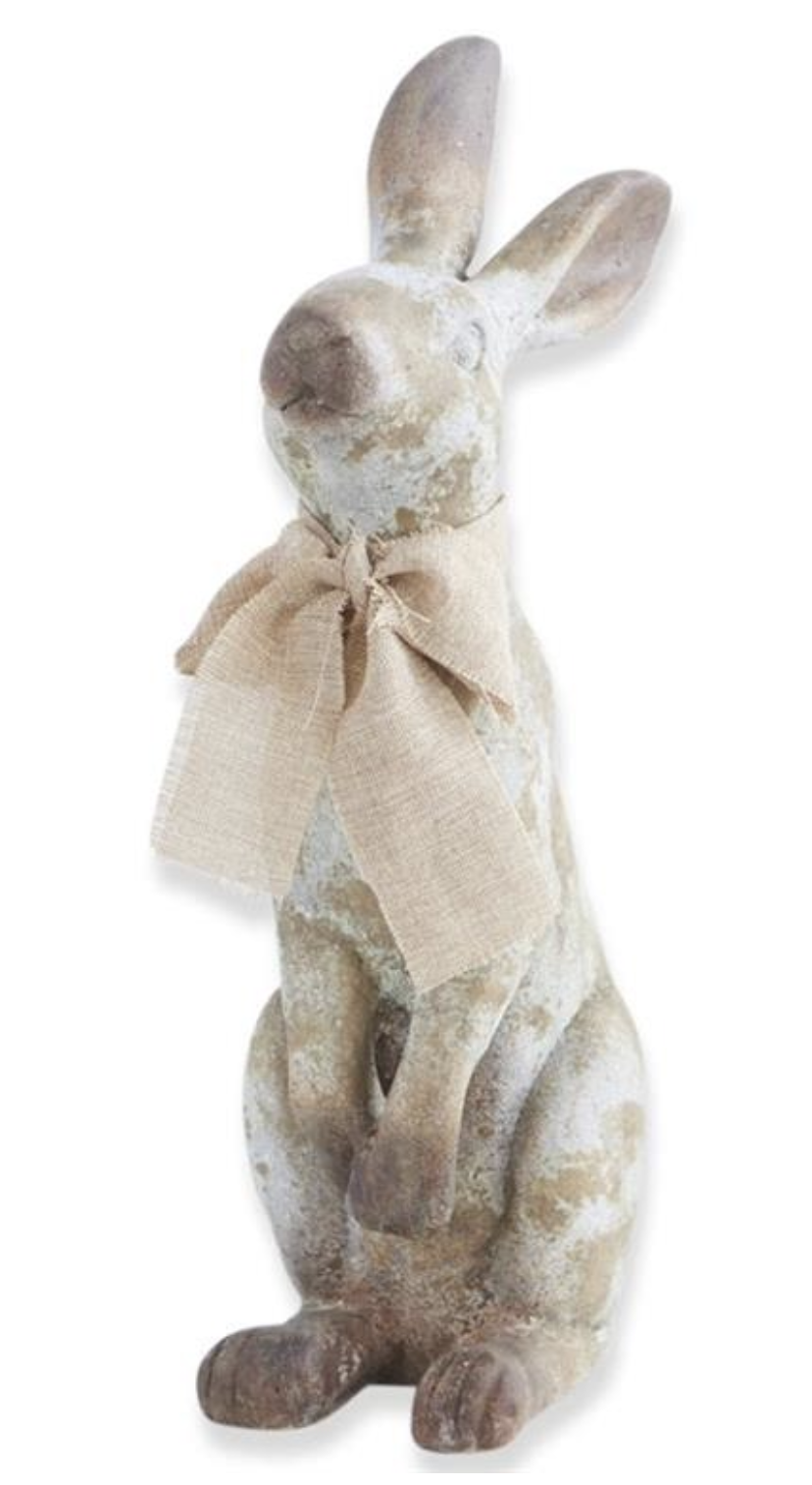 Decorative rabbit figurine with a bow on a white background