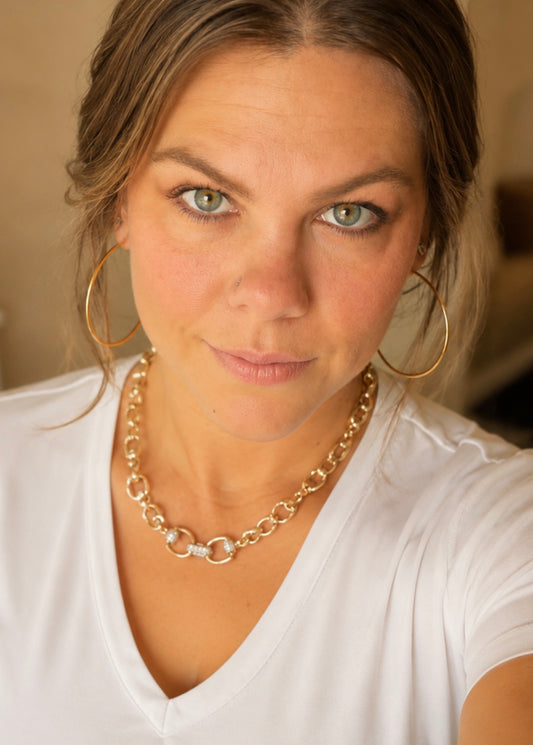Woman wearing Adelaide gold horse bit necklace