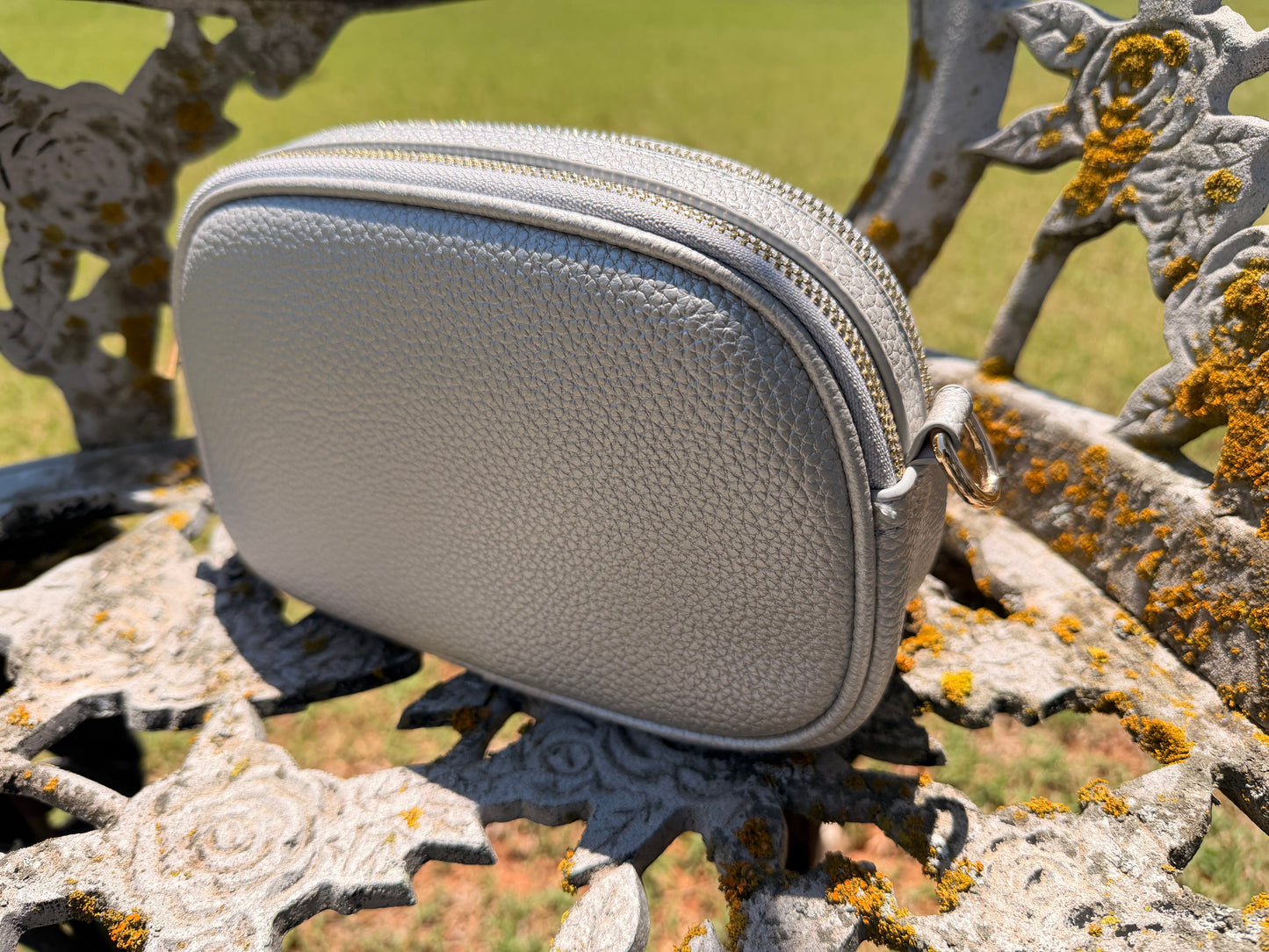 Side profile of The Elodie Pebble Crossbody in Moonlit Silver featuring a softly structured silhouette and pebble texture.