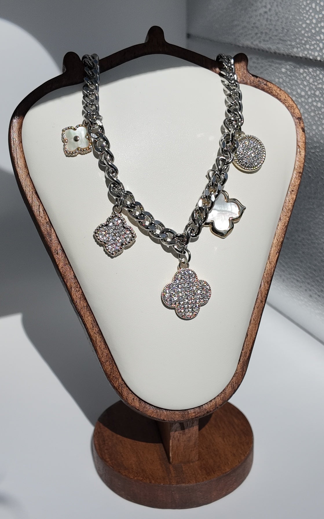 Giselle Motif Necklace on cream wood bust