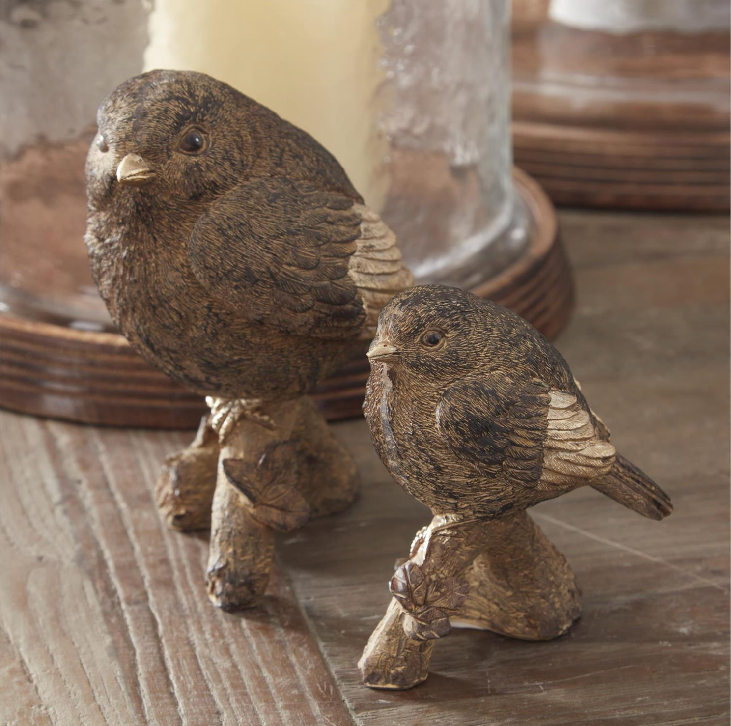 Hedgerow Wren and Briar Wren brown-and-gold decorative bird figurines styled together on a tabletop.