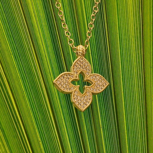 Close-up of Juliette Open Motif Necklace with pavé detailing and gold chain styling
