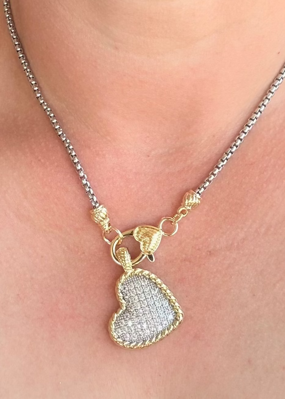     Woman wearing Kimberly Pavé Two-Tone Heart Necklace in gold and silver mixed metal design