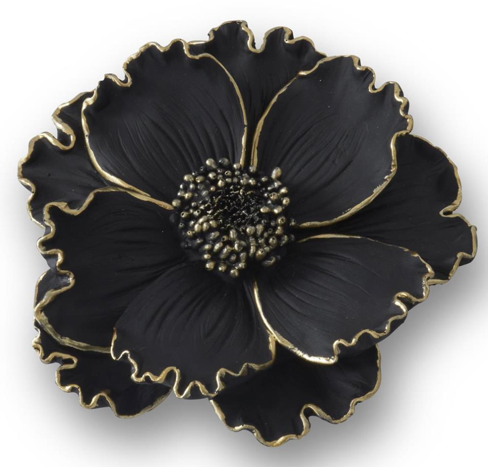 Black flower-shaped object with gold accents on a white background