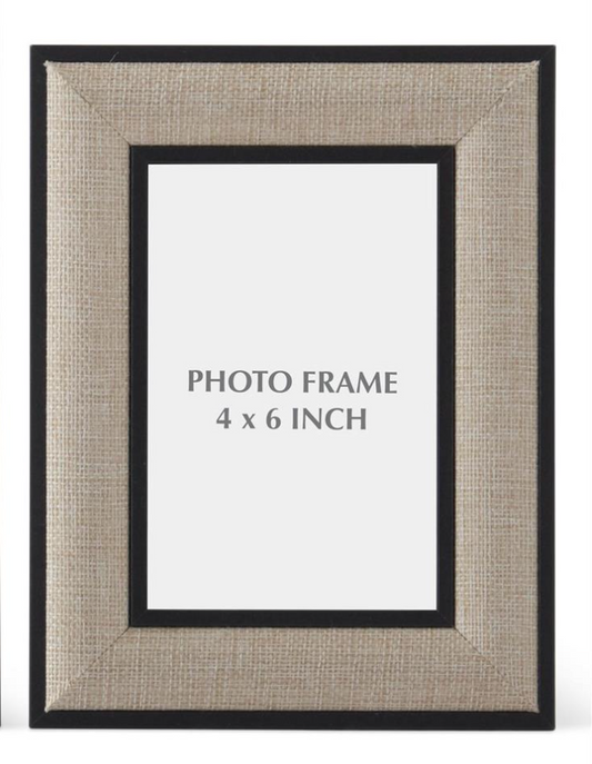 Petite black and natural linen tabletop photo frame designed to hold a 4-by-6-inch photograph.